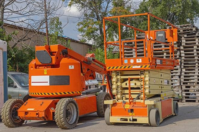 warehouse worker operating forklift to stack inventory in Glendora, CA